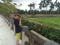 Sneed's son Braden filming birds in Taiwan